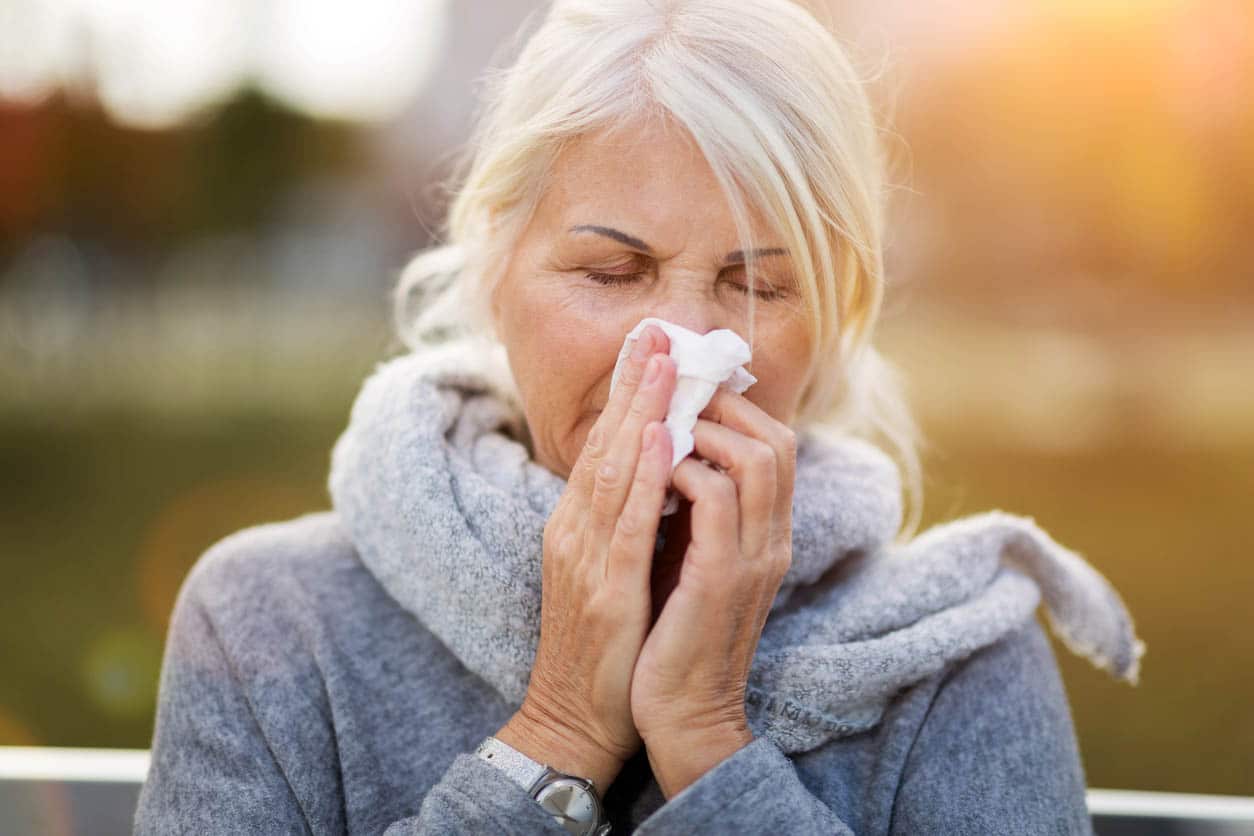 Sick Woman Blowing Her Nose