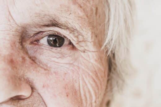 Close Up Image Of Old Woman's Eye, Looking At Camera